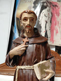 Statua religiosa in legno raffigurante Santo con croce e libro